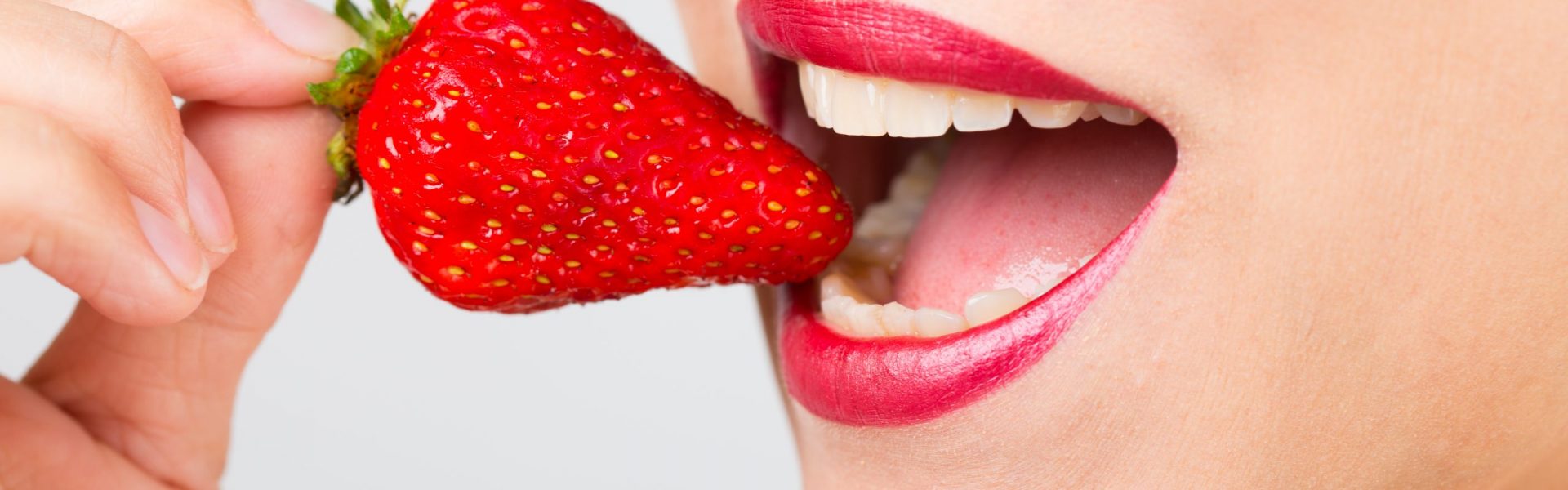 woman mouth with strawberry